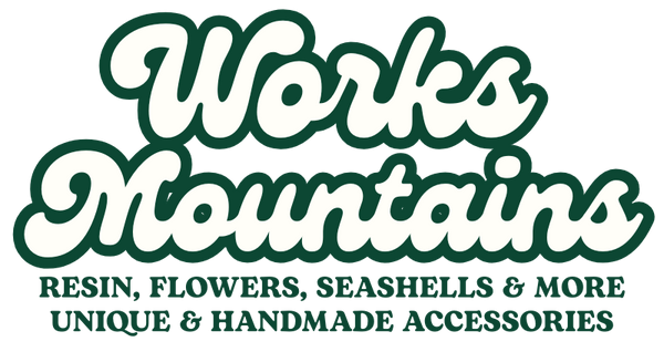 Logo of Works Mountains with text about unique and handmade accessories on a white background