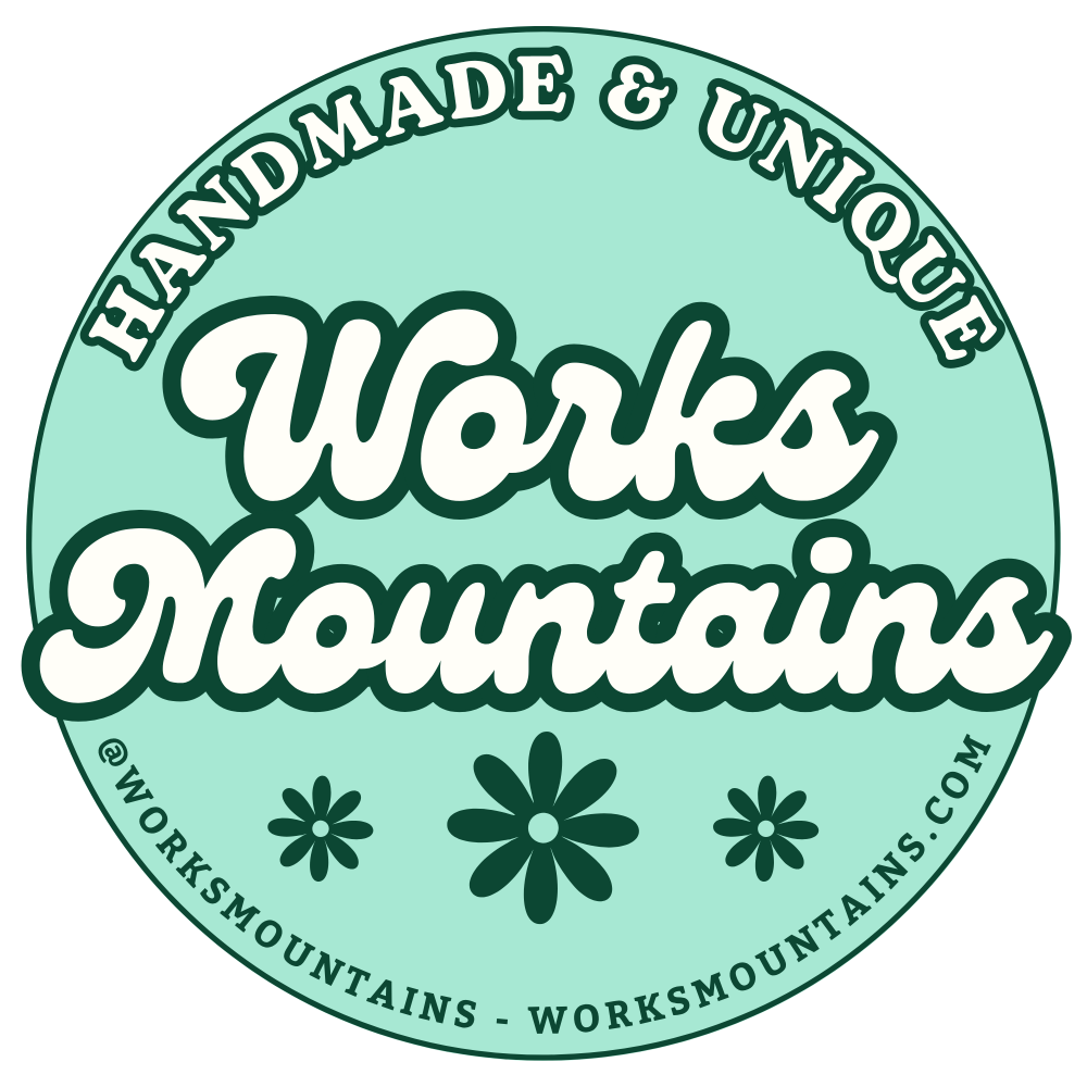 Circular logo with 'Works Mountains' text on a light green background